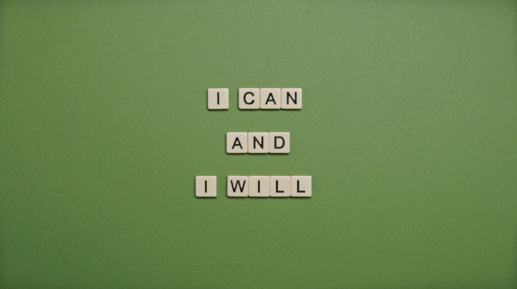pexels-photo-5662855-5662855-1 Inspirational message 'I Can and I Will' spelled with tile letters on a green background.